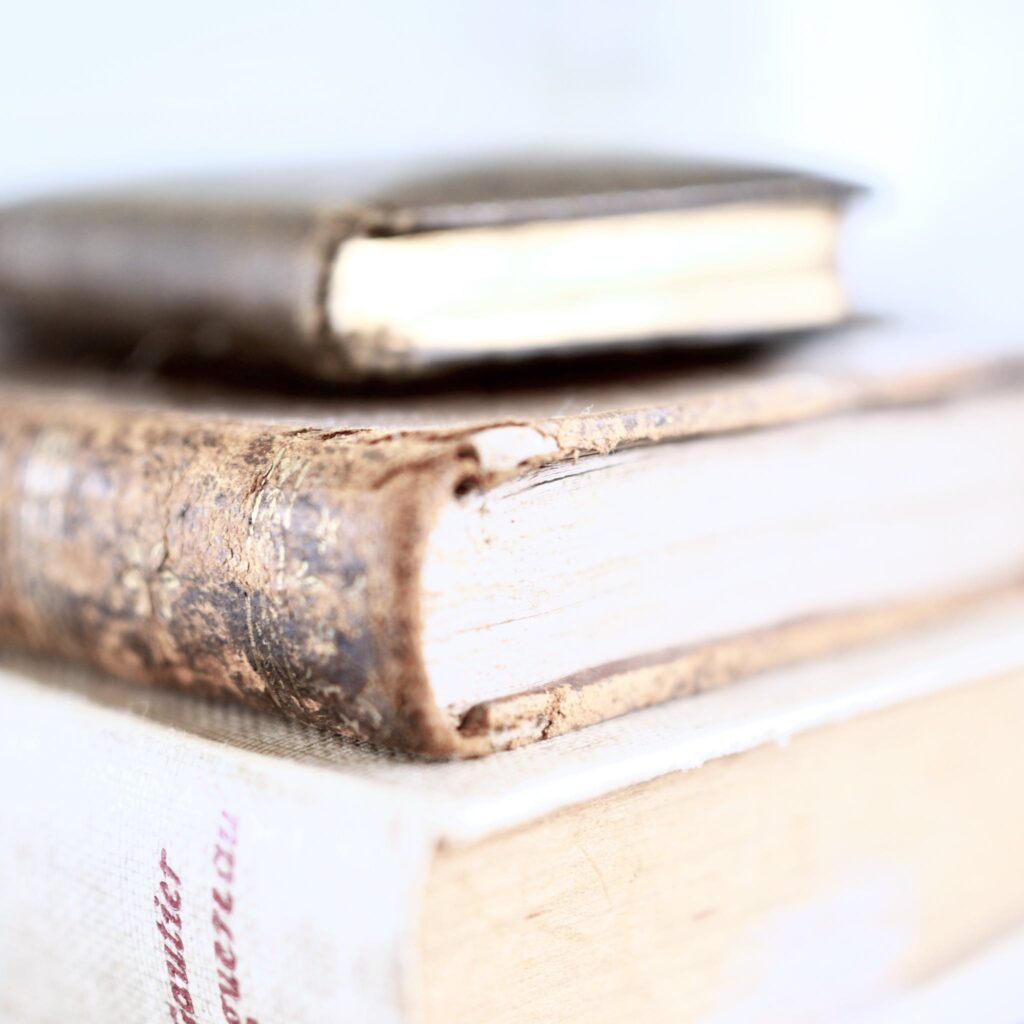 Stack of thick books on table